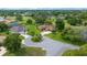 An aerial view showcases the home's landscaping and circular driveway at 10044 Twelve Oaks Ct, Weeki Wachee, FL 34613