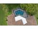 Aerial view of the caged pool and manicured backyard at 10044 Twelve Oaks Ct, Weeki Wachee, FL 34613
