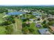 Aerial shot features a large lake and golf course community at 10044 Twelve Oaks Ct, Weeki Wachee, FL 34613