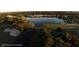 Aerial view of the golf course and pond showcasing the lush landscaping and recreational amenities at 10044 Twelve Oaks Ct, Weeki Wachee, FL 34613