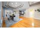 Dining area featuring hardwood floors, a dining table with seating, and access to the kitchen at 10044 Twelve Oaks Ct, Weeki Wachee, FL 34613