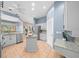 Modern kitchen with stainless steel appliances, island, and stylish gray cabinets at 10044 Twelve Oaks Ct, Weeki Wachee, FL 34613