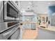 Modern kitchen featuring stainless steel appliances and granite countertops at 10044 Twelve Oaks Ct, Weeki Wachee, FL 34613
