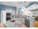Well-equipped kitchen with granite countertops, stainless steel appliances, and tiled backsplash at 10044 Twelve Oaks Ct, Weeki Wachee, FL 34613