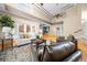 Spacious living room featuring high ceilings, hardwood floors, and natural light at 10044 Twelve Oaks Ct, Weeki Wachee, FL 34613