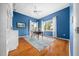 Bright office with hardwood floors, a ceiling fan, beautiful windows and a blue accent wall at 10044 Twelve Oaks Ct, Weeki Wachee, FL 34613
