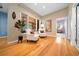 Bright sitting area with hardwood floors, comfortable seating, and natural light at 10044 Twelve Oaks Ct, Weeki Wachee, FL 34613