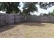 Large backyard with mature trees and a wood fence, perfect for outdoor activities and privacy at 101 Sheryl Lynn Dr, Brandon, FL 33510