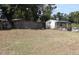 Spacious backyard featuring a shed and gazebo, providing ample space for outdoor living and storage at 101 Sheryl Lynn Dr, Brandon, FL 33510