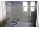 Modest bathroom featuring a shower-tub combo, toilet, and storage cabinet at 101 Sheryl Lynn Dr, Brandon, FL 33510
