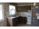 Kitchen featuring wood cabinets and an open under-sink area at 101 Sheryl Lynn Dr, Brandon, FL 33510