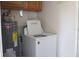 Laundry area with water heater and washing machine at 101 Sheryl Lynn Dr, Brandon, FL 33510