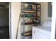 Laundry area with washing machine, shelving unit, and other room view at 101 Sheryl Lynn Dr, Brandon, FL 33510