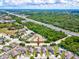Aerial view of a home in a community, close to the highway at 10120 Ives Loop, Hudson, FL 34667