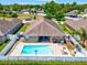 A spacious backyard with a large pool and hot tub perfect for relaxation and entertaining at 10120 Ives Loop, Hudson, FL 34667