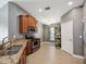 Kitchen features stainless steel appliances, granite countertops, and wood cabinets at 10120 Ives Loop, Hudson, FL 34667