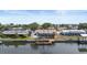 An aerial view shows the home's location on the water, with a private dock and easy access to the bay at 1024 Spindle Palm Way, Apollo Beach, FL 33572