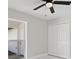 Neutral bedroom with a ceiling fan and closet perfect for creating a cozy atmosphere at 1024 Spindle Palm Way, Apollo Beach, FL 33572