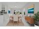 Elegant dining room with a large table, comfortable chairs, and stylish decor at 1024 Spindle Palm Way, Apollo Beach, FL 33572