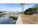 Picturesque dock and canal view, perfect for boating, fishing, or enjoying the waterfront lifestyle at 1024 Spindle Palm Way, Apollo Beach, FL 33572