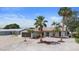 Charming single-story home with well-kept landscaping, a two-car garage, and lots of curb appeal at 1024 Spindle Palm Way, Apollo Beach, FL 33572