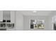 Bright eat-in kitchen featuring modern appliances, white countertops, and ample natural light at 1024 Spindle Palm Way, Apollo Beach, FL 33572