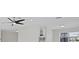 This bright living room boasts modern recessed lights, and a view of the kitchen and breakfast bar at 1024 Spindle Palm Way, Apollo Beach, FL 33572