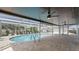 Screened-in pool with brick pavers, offering a private outdoor space for relaxation and entertainment at 1024 Spindle Palm Way, Apollo Beach, FL 33572