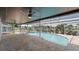 Inviting pool area with a paved patio, screened enclosure, and well-maintained pool at 1024 Spindle Palm Way, Apollo Beach, FL 33572