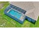 Aerial view of pool and spa with screened enclosure at 10250 Locker Dr, Spring Hill, FL 34608