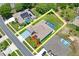 A beautiful property line view with a screened-in pool and colorful landscaping at 10250 Locker Dr, Spring Hill, FL 34608