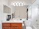 Cozy bathroom with a sink, vanity, and shower-tub combo for added convenience at 10250 Locker Dr, Spring Hill, FL 34608