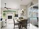 Bright dining area with view into the living room and screened-in pool at 10250 Locker Dr, Spring Hill, FL 34608