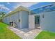 Exterior home view showcasing access to the outdoor patio and pool area at 10250 Locker Dr, Spring Hill, FL 34608