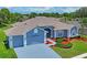 An elevated view of a well-maintained home with attractive landscaping at 10250 Locker Dr, Spring Hill, FL 34608