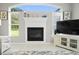 Living room fireplace detail with decor and a view to the back yard at 10250 Locker Dr, Spring Hill, FL 34608