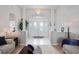 Elegant foyer with a chandelier, tiled floor, and an arched entryway leading to the living area at 10250 Locker Dr, Spring Hill, FL 34608