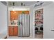 Kitchen featuring a stainless steel refrigerator and a pantry with shelving at 10250 Locker Dr, Spring Hill, FL 34608