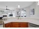 Kitchen sink and countertop overlooking the living area and screened-in pool at 10250 Locker Dr, Spring Hill, FL 34608