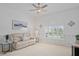 Inviting living room with neutral colors, large window, and comfortable seating area at 10250 Locker Dr, Spring Hill, FL 34608