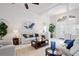 Open living room with columns, view of the foyer, and comfortable seating, creating an inviting atmosphere at 10250 Locker Dr, Spring Hill, FL 34608