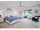 Main bedroom with a ceiling fan, backyard access, and soothing light at 10250 Locker Dr, Spring Hill, FL 34608