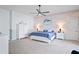 Spacious main bedroom featuring a ceiling fan and ample natural light at 10250 Locker Dr, Spring Hill, FL 34608