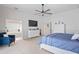 Main bedroom featuring an en suite bath, TV, and plenty of closet space at 10250 Locker Dr, Spring Hill, FL 34608
