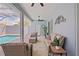 Enclosed patio featuring wicker furniture and decor, perfect for relaxing near the pool at 10250 Locker Dr, Spring Hill, FL 34608