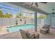 Inviting pool and patio area, complete with lounge chairs for enjoying the sun at 10250 Locker Dr, Spring Hill, FL 34608