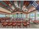 Bright casual dining room offering lake views with tables and a bar at 1033 Ashbourne Cir, Trinity, FL 34655