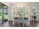 Cozy breakfast nook with natural light and views of the lush backyard at 1033 Ashbourne Cir, Trinity, FL 34655