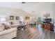 Bright living room featuring hardwood floors, neutral walls, and modern furniture at 1033 Ashbourne Cir, Trinity, FL 34655