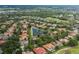 Community aerial view with golf course, Fox Hollow Golf Club & Restaurant and water features, showcasing the neighborhood amenities at 10531 Pontofino Cir, Trinity, FL 34655